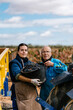 © Ezequiel Giménez/Stocksy - Young lady with grandfather working in vineyard