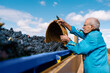 © Ezequiel Giménez/Stocksy - Elderly man pouring grapes into truck in vineyard