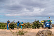 © Ezequiel Giménez/Stocksy - Multi generational family working together in vineyard