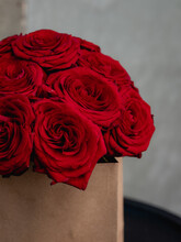 Red Roses In A Brown Bag