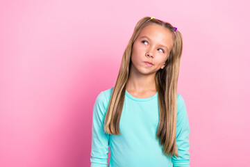 Wall Mural - Closeup photo of youngster preteen cute little lady long blonde hair dreamy pouted lips interested look empty space isolated on pink color background