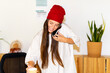 © Eloisa Ramos/Stocksy - casual woman talking by phone at cozy office
