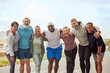 Fitness, portrait and group of friends in city ready for training, workout or exercise. Face, sports and teamwork of senior people together with coach outdoors preparing for exercising, jog or cardio