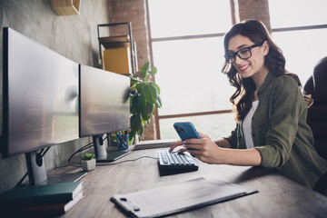 Wall Mural - profile portrait of successful smart web designer girl sit chair keyboard write hold telephone netwo