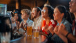 © Gorodenkoff - Group of Soccer Fans Sitting at a Bar Counter, Drinking, Watching a Live Football Match Broadcast on TV. People Cheering, Supporting Their Team. Crowd Goes Ecstatic When Team Scores a Decisive Goal.