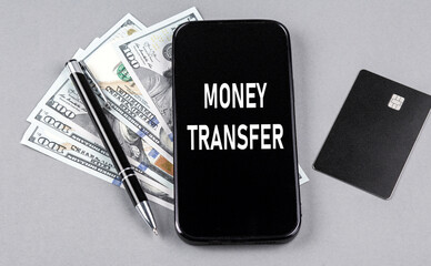 Poster - Credit card and text MONEY TRANSFER on smartphone with dollars and pen. Business concept