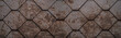 Abstract seamless orange brown rusty geometric rhombus diamond hexagon 3d scratched old tiles rust wall texture background banner wide panorama panoramic