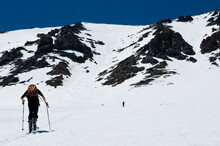 During His Last Ski Tour For The Season, A Young Man Skins Up For The Summit In June Lake, California.