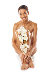 Poster - Skincare, portrait and beauty of woman with flowers in studio on a white background mock up. Floral cosmetics, organic makeup and female model with orchids on legs for skin treatment and body care.