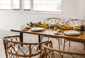 Sticker - Beautiful table setting with mimosa flowers and candles in room