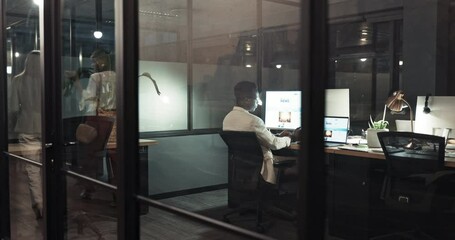 Poster - Computer, night and overtime with a business black man at work behind glass in an office on a deadline. Dark, target and desktop with an african male employee working on a project at his desk