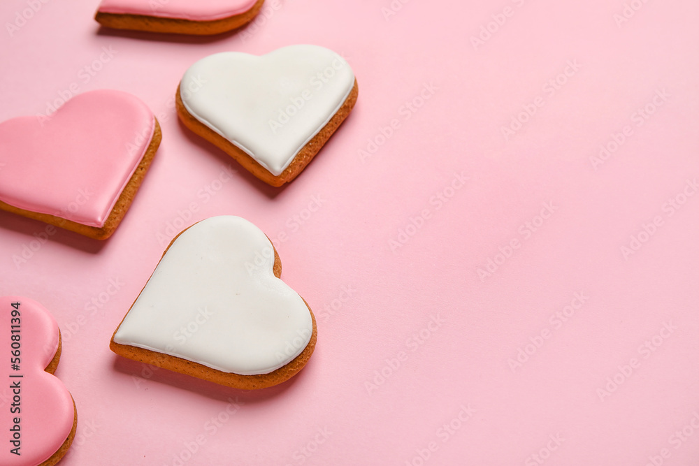 Different heart shaped cookies on pink background, closeup. Valentines Day celebration