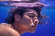 An 18-year-old Mexican adult man relaxing serenely with eyes closed and hair swirling underwater, Generative AI