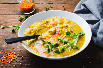 Wall Mural - Lentil Soup, Homemade Vegetable Soup with Chicken and Herbs on Wooden Background, Healthy Eating