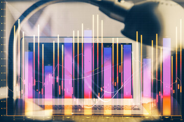 Poster - Financial graph colorful drawing and table with computer on background. Double exposure. Concept of international markets.