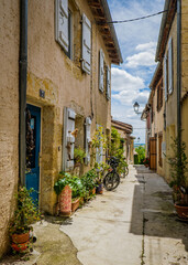 Naklejka na meble Cute, flowery and narrow streets of the small village of Lectoure in the south of France (Gers)