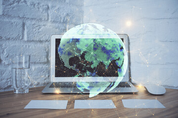 Poster - Computer on desktop with social network hologram. Double exposure. Concept of international people connections.