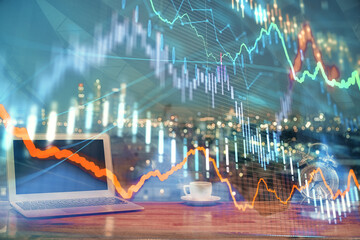Poster - Financial graph colorful drawing and table with computer on background. Double exposure. Concept of international markets.