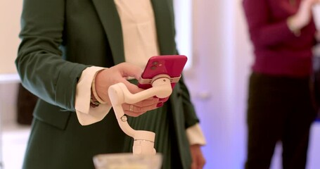 Poster - An unrecognizable female business coach uses phone to perform her professional duties. Online coordination activities. Launching a live broadcast of a speech at a conference. Gadgets in people lives.