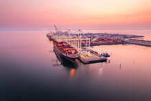 Cargo Terminal Loading Shipping Containers Onto Cargo Ships, Aerial Footage, Hyperlapse, Vancouver, BC, Canada, Marine Terminal, Cargo Crane.