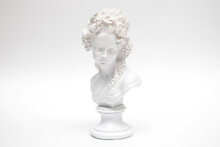 Decorative Plaster Statuette Of A Woman Head On White Background