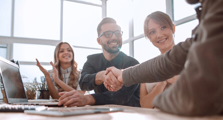 Poster - handshake business people at a meeting in the office