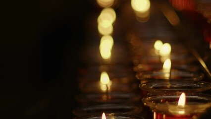 Wall Mural - Red Wish and Pray Candles in a Catholic Church