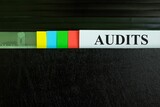 Fototapeta  - Audit file record in black binder folder. Auditing in company organization concept.