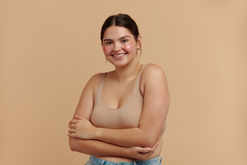 under eye patches. closeup of plus size woman with natural makeup and healthy fresh skin posing with