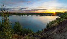 Sunset Over The Horizon And At The Water Quarry . Leningrad Region. Vsevolozhsk.