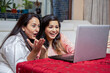 © GAJENDRRA BHATI  - Excited young Indian women using laptop with surprised expression on their face, Ladies win online lottery jackpot, Asian girls receive unbelievable good news on computer. black friday sale.