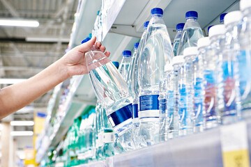 Wall Mural - Drinking water in hand at shop