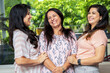 © GAJENDRRA BHATI  - Three Happy indian women standing together at home. Mother with two young daughters having fun laughing. Closeup
