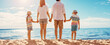 © candy1812 - Mother and father with their children standing on the beach on the resort.