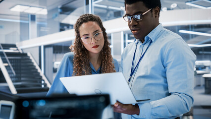 Aufkleber - Portrait of Two Young Diverse Engineers Use Computer to Connect, Analyze and Discuss How to Program a Robot Dog. High Tech Research Laboratory with Modern Equipment.