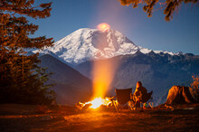 The Bright Glow Of A Campfire With Mount Rainier