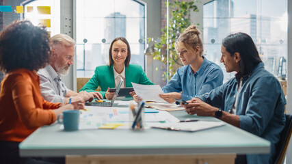 Leinwandbilder - In the Stylish Modern Office Meeting Room: Diverse Group of Business Growth Marketing Professionals Use Laptop and Tablet, Discuss Project Ideas, Brainstorm Company Strategies