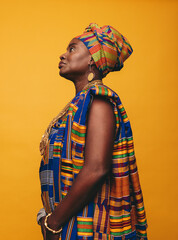 Wall Mural - Elegant African woman wearing cultural clothing in a studio