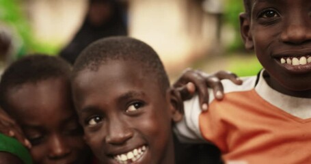 a group of african children, laughing and playing, little faces full of joy and life. with playful p