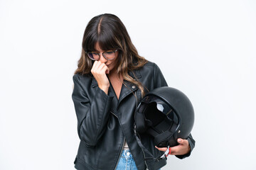 Wall Mural - Young caucasian woman with a motorcycle helmet isolated on white background having doubts