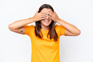 Poster - Young caucasian woman isolated on white background covering eyes by hands and smiling