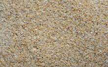 Fine Beach Sand Background, Close-up Shot. Sea Sand Wallpaper. Almost Even Distribution Of Light. Beach Sand Contains Quartz (silica) And Feldspar.