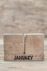 Wall Mural - cube calendar for January on wooden background with copy space