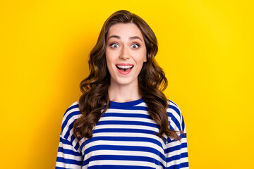 Sticker - Photo of cheerful impressed young lady wear striped shirt smiling open mouth isolated yellow color background