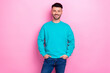 © deagreez - Photo of young cheerful satisfied guy wear blue jumper hands pockets successful entrepreneur smiling enjoy his job isolated on pink color background
