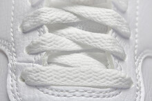 Macro Of White Shoelaces Of White Leather Shoes