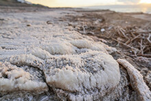 Sand And Stones Covered With Crystalline Salt Crust On Shore Of Dead Sea, Closeup Macro Detail