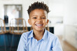 © Wavebreak Media - Portrait of happy african american boy looking at camera and smiling