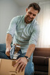 © ivanko80 - Young man packing order for shipping to customer