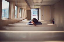 Young Woman Leaning On Bench While Riding Ferry, Maine, USA